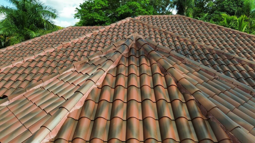 Close-up of a terracotta barrel tile roof ridge