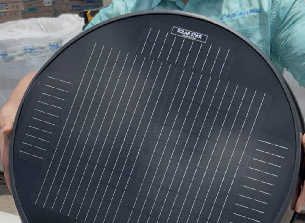 Close-up of a round solar attic fan panel
